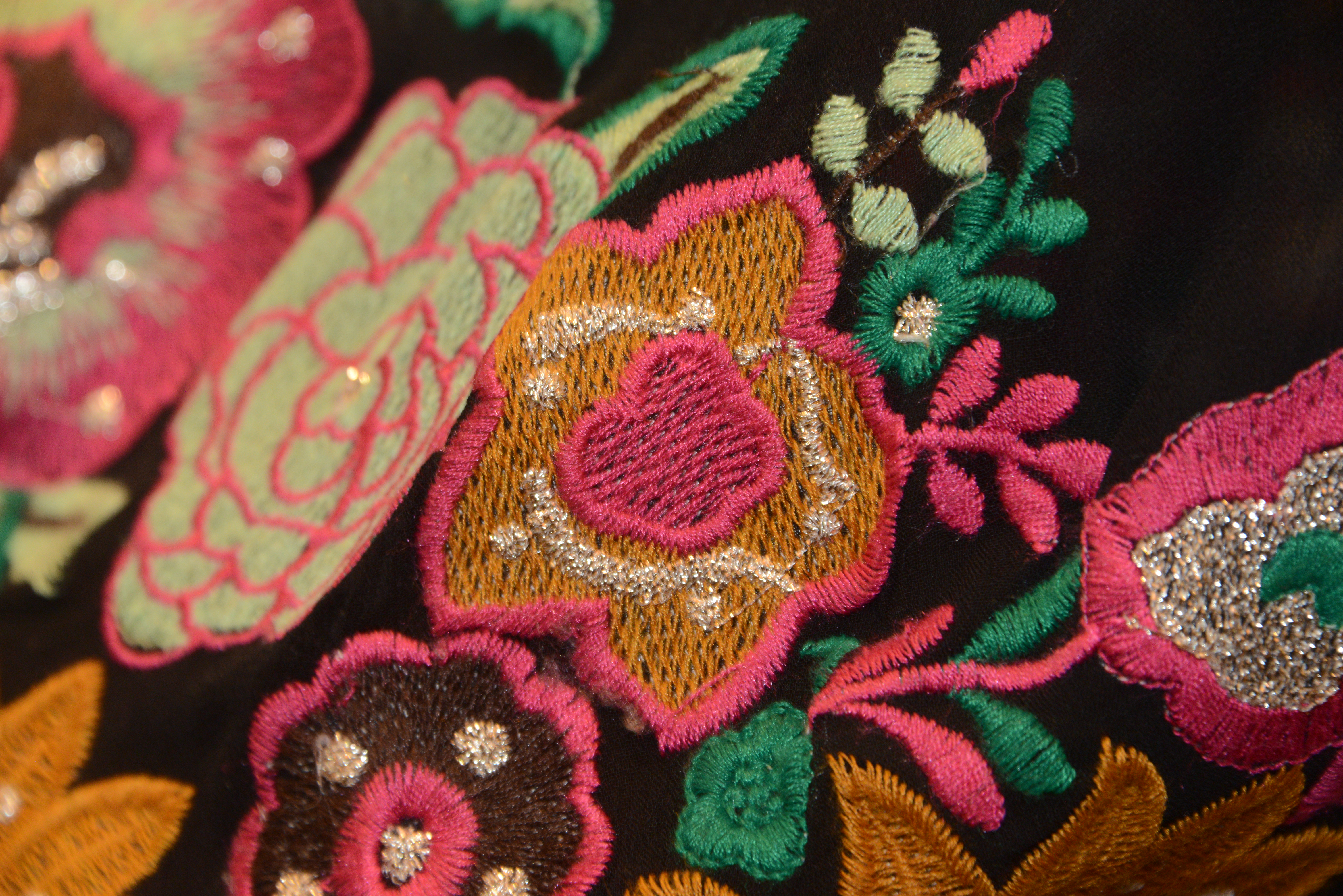 Embroidery detail in gold thread